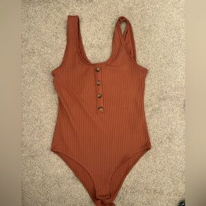 Cute orange bodysuit!